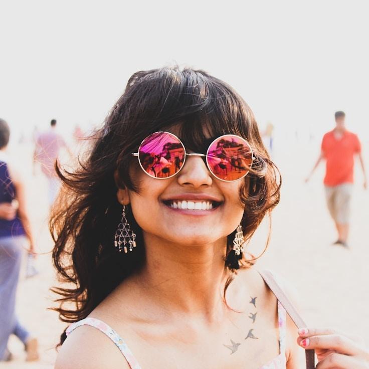 Kaveri Mehta, Lead Design Curator at RiverCanvasPulse, reviewing corporate floral arrangements